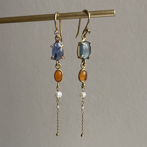 reringe tanzanite, opal og perler